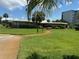 Building exterior with manicured lawn and walkway at 4480 Ironwood Cir # 308A, Bradenton, FL 34209
