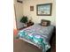 Cozy bedroom with a bed, nightstand, and artwork at 4480 Ironwood Cir # 308A, Bradenton, FL 34209