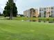 Golf course with pond, trees, and residential buildings at 4480 Ironwood Cir # 308A, Bradenton, FL 34209
