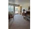 Living room with seating, coffee table, and access to balcony at 4480 Ironwood Cir # 308A, Bradenton, FL 34209