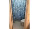 Bathroom with seashell-themed shower curtain and toilet at 4480 Ironwood Cir # 308A, Bradenton, FL 34209