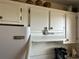 White cabinets and Frigidaire appliances in this well-lit kitchen at 4480 Ironwood Cir # 308A, Bradenton, FL 34209