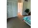 Bedroom with a double closet and carpet flooring at 4480 Ironwood Cir # 308A, Bradenton, FL 34209