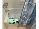 Bathroom with bathtub, shower, and a patterned bathmat at 4480 Ironwood Cir # 308A, Bradenton, FL 34209