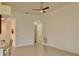 Spacious living room with tile floors and ceiling fan at 13575 Salinas St, Venice, FL 34293