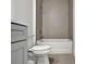 Bathroom with gray tile, vanity, and a shower/tub combo at 2605 Waterfront Cir, Sarasota, FL 34240