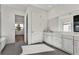 Spa-like bathroom with double vanity and grey tile at 2605 Waterfront Cir, Sarasota, FL 34240