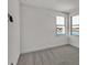 Bedroom with grey carpet and two windows with water views at 2605 Waterfront Cir, Sarasota, FL 34240
