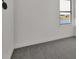 Bright bedroom with grey carpet and a large window offering water views at 2605 Waterfront Cir, Sarasota, FL 34240