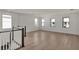Spacious bonus room with hardwood floors and multiple windows at 2605 Waterfront Cir, Sarasota, FL 34240