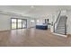 Open living room with kitchen island and hardwood floors at 2605 Waterfront Cir, Sarasota, FL 34240