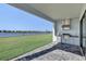 Outdoor kitchen with stainless steel appliances and lake view at 2605 Waterfront Cir, Sarasota, FL 34240