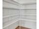 Spacious pantry with ample shelving for storage at 2605 Waterfront Cir, Sarasota, FL 34240