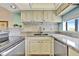 Updated kitchen with granite countertops and new appliances at 6157 Midnight Pass Rd # E24, Sarasota, FL 34242