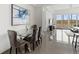 Elegant dining area with glass table and gray chairs at 10520 Boardwalk Loop # 302, Bradenton, FL 34202