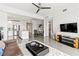 Open living room showcasing modern furniture and kitchen access at 10520 Boardwalk Loop # 302, Bradenton, FL 34202