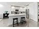 Modern kitchen featuring white cabinets, stainless steel appliances, and an island at 10520 Boardwalk Loop # 302, Bradenton, FL 34202