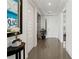 Modern hallway with tile floors, white walls, and neutral decor at 10520 Boardwalk Loop # 302, Bradenton, FL 34202