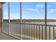 Spacious screened balcony with scenic lake view at 10520 Boardwalk Loop # 302, Bradenton, FL 34202