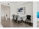 Bright dining area with glass table and four gray chairs at 10520 Boardwalk Loop # 302, Bradenton, FL 34202