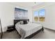 Bright bedroom with a large window and lake view at 10520 Boardwalk Loop # 302, Bradenton, FL 34202
