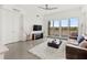 Living area with lake view and sliding glass doors at 10520 Boardwalk Loop # 302, Bradenton, FL 34202