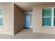 Private condo entrance with light blue door and neutral color scheme at 10520 Boardwalk Loop # 302, Bradenton, FL 34202