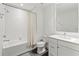 Clean bathroom with white subway tiles, bathtub, and vanity at 10520 Boardwalk Loop # 302, Bradenton, FL 34202