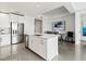 Modern kitchen with white cabinets, stainless steel appliances and an island at 10520 Boardwalk Loop # 302, Bradenton, FL 34202