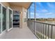 Balcony with sliding doors to bedroom and lake view at 10520 Boardwalk Loop # 302, Bradenton, FL 34202