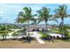 Community playground and pavilion with palm trees at 8549 Whispering St, Sarasota, FL 34240