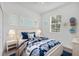 Charming bedroom with a queen-size bed and coastal decor at 8549 Whispering St, Sarasota, FL 34240