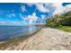 Seashore with sandy beach and calm water at 3301 Bay Shore Rd, Sarasota, FL 34234