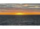Orange and yellow sunset over calm ocean water at 3301 Bay Shore Rd, Sarasota, FL 34234
