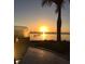 Relaxing sunset view with a glass of wine at 3301 Bay Shore Rd, Sarasota, FL 34234