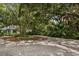 Circular driveway surrounded by tropical landscaping at 3301 Bay Shore Rd, Sarasota, FL 34234