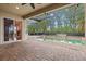 Screened pool area with brick patio and lush landscaping at 10115 Day Lily Ct, Bradenton, FL 34212