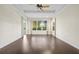 Bright bedroom with hardwood floors and ceiling fan at 10115 Day Lily Ct, Bradenton, FL 34212