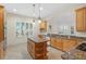 Kitchen features granite countertops, island, stainless steel appliances, and wood cabinets at 10115 Day Lily Ct, Bradenton, FL 34212