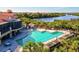 Resort-style pool with lounge chairs and adjacent clubhouse at 10115 Day Lily Ct, Bradenton, FL 34212