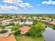 Lakeside home with terracotta roof and mature landscaping at 10115 Day Lily Ct, Bradenton, FL 34212