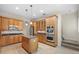 Kitchen boasts granite countertops, stainless steel appliances, and ample wood cabinetry at 10115 Day Lily Ct, Bradenton, FL 34212