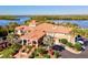 Community clubhouse with tile roof and waterfront views at 10115 Day Lily Ct, Bradenton, FL 34212