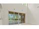 Gathering room with sliding glass doors leading to the pool at 10115 Day Lily Ct, Bradenton, FL 34212
