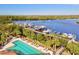 Community pool with lounge chairs and marina views at 10115 Day Lily Ct, Bradenton, FL 34212