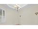 Bright dining room features a chandelier, crown molding, and plantation shutters at 10115 Day Lily Ct, Bradenton, FL 34212