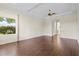 Large bedroom with hardwood floors and access to backyard at 10115 Day Lily Ct, Bradenton, FL 34212