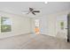 Bright bedroom featuring a large window and ceiling fan at 10115 Day Lily Ct, Bradenton, FL 34212
