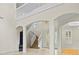 Grand two-story entryway with elegant staircase at 10115 Day Lily Ct, Bradenton, FL 34212