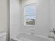 Clean bathroom with shower/tub combo and window at 10115 Day Lily Ct, Bradenton, FL 34212